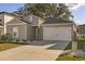 Eye-catching home with a white garage door and neat landscaping at 1104 Saltgrass Way, Myrtle Beach, SC 29588