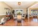 Second view of the dining room, showcasing a round glass-top table with four ornate chairs at 1991 Lees Landing Circle, Conway, SC 29526