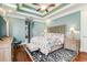 Main bedroom with hardwood floors, tray ceiling and ceiling fan at 2073 Timmerman Rd., Myrtle Beach, SC 29588