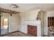 Living room with exposed brick fireplace and hardwood floors at 228 Saint James St., Georgetown, SC 29440