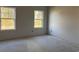 Empty bedroom with two windows and bare floor at 240 Palmetto Sand Loop, Conway, SC 29527