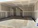 Unfinished garage interior with drywall and concrete floor at 240 Palmetto Sand Loop, Conway, SC 29527