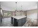 Kitchen island with quartz countertop and dark cabinets at 2711 Highway 9 Business W, Loris, SC 29569