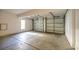 Spacious two-car garage with white doors and concrete floor at 298 Crane Dr., Pawleys Island, SC 29585