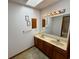 Double vanity bathroom with skylight and mirror at 319 Rice Mill Dr., Myrtle Beach, SC 29588