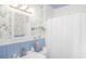 Small bathroom with floral wallpaper and white subway tile at 332 N Congdon St., Georgetown, SC 29440