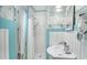 Small bathroom with shower and floral wallpaper at 332 N Congdon St., Georgetown, SC 29440
