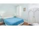 Bedroom with queen bed, white wardrobe, and blue accents at 332 N Congdon St., Georgetown, SC 29440