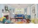 Bright living room with fireplace, comfy seating, and colorful rug at 332 N Congdon St., Georgetown, SC 29440