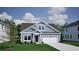 Two-story craftsman style home with gray siding, stone accents and a two-car garage at 335 Happy Valley Dr., Myrtle Beach, SC 29588