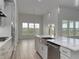 Modern kitchen with large island, stainless steel appliances, and white cabinets at 335 Happy Valley Dr., Myrtle Beach, SC 29588