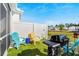 Private backyard with turf, grill, and seating area at 4036-D Taranto Loop # 5404-D, Myrtle Beach, SC 29579