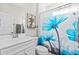 Clean bathroom with white vanity, blue shower curtain, and decorative accents at 4036-D Taranto Loop # 5404-D, Myrtle Beach, SC 29579