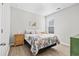 Bright bedroom with double bed, wood-look floors, and window at 4036-D Taranto Loop # 5404-D, Myrtle Beach, SC 29579