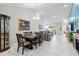 Dining room with dark wood table and chairs, open to living area at 4036-D Taranto Loop # 5404-D, Myrtle Beach, SC 29579