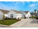 White house with gray roof, landscaping, and driveway at 4036-D Taranto Loop # 5404-D, Myrtle Beach, SC 29579