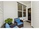 Cozy front porch with seating and a welcoming wreath on the door at 4036-D Taranto Loop # 5404-D, Myrtle Beach, SC 29579