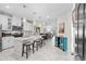 Modern kitchen with white cabinets, island, and marble flooring at 4036-D Taranto Loop # 5404-D, Myrtle Beach, SC 29579