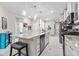 Open concept kitchen with island, stainless steel appliances, and white cabinets at 4036-D Taranto Loop # 5404-D, Myrtle Beach, SC 29579