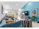Living room with sectional sofa, large TV, and blue accent wall at 4036-D Taranto Loop # 5404-D, Myrtle Beach, SC 29579