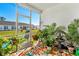 Screened porch with fountain, plants and view of backyard at 4036-D Taranto Loop # 5404-D, Myrtle Beach, SC 29579