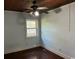 Empty bedroom with light blue walls, wood floors, and a ceiling fan at 4325 Ellis Ave., Little River, SC 29566