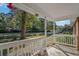 White porch with railing, view of street and trees at 538 Oak Circle Dr., Myrtle Beach, SC 29588