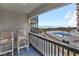 Balcony with ocean and pool view, seating for two at 6000 N Ocean Blvd. # 214, North Myrtle Beach, SC 29582