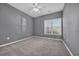 Bedroom with grey walls, carpet flooring, and a window with blinds at 802 Silver Maple Ct., Myrtle Beach, SC 29579