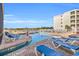 Resort-style pool with plenty of lounge chairs at 9400 Shore Dr. # 317, Myrtle Beach, SC 29572