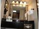 Bathroom vanity with granite countertop and mirror at 1200 N Ocean Blvd. # 307, Myrtle Beach, SC 29577