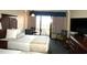 Two beds, balcony view, and a small table at 1200 N Ocean Blvd. # 307, Myrtle Beach, SC 29577