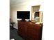 Dark wood dresser with TV and mirror at 1200 N Ocean Blvd. # 307, Myrtle Beach, SC 29577
