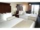 Two beds, balcony view, and a small table at 1200 N Ocean Blvd. # 307, Myrtle Beach, SC 29577