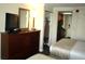 Dark wood dresser with TV and mirror at 1200 N Ocean Blvd. # 307, Myrtle Beach, SC 29577