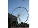Large Ferris wheel with many passenger cars against a clear blue sky at 1200 N Ocean Blvd. # 307, Myrtle Beach, SC 29577