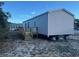 Gray mobile home with wooden deck and steps at 1412 Seagull Blvd., North Myrtle Beach, SC 29582