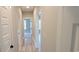 Light and bright hallway with light hardwood floors at 1521 Hawthorn Dr., Pawleys Island, SC 29585