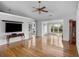 Living room with hardwood floors and a view to sunroom at 1758 Starbridge Dr., Surfside Beach, SC 29575