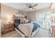 Comfortable bedroom with a queen-size bed and access to a private balcony at 1806 N Ocean Blvd. # 104A, North Myrtle Beach, SC 29582