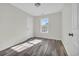 Simple bedroom with a window and hardwood-look flooring at 1960 Hampton St., Georgetown, SC 29440