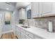 Modern kitchen with white cabinets, quartz countertops, and stainless steel sink at 1969 Governors Landing Rd. # 224, Murrells Inlet, SC 29576