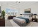 Bright main bedroom with carpeted floors, large windows, and stylish furniture at 2034 Comradery Way, Murrells Inlet, SC 29576