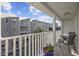 Private balcony overlooking the community with outdoor seating at 209 North Hillside Dr. # 201, North Myrtle Beach, SC 29582