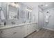Elegant bathroom with double vanity and a large mirror at 209 North Hillside Dr. # 201, North Myrtle Beach, SC 29582
