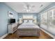 Cozy bedroom with a queen bed and plenty of natural light at 209 North Hillside Dr. # 201, North Myrtle Beach, SC 29582