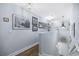 Bright hallway with framed artwork and hardwood floors at 209 North Hillside Dr. # 201, North Myrtle Beach, SC 29582