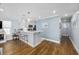 Modern kitchen with white cabinets, quartz counters, and a breakfast bar at 209 North Hillside Dr. # 201, North Myrtle Beach, SC 29582