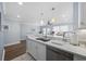 Modern kitchen with white cabinets, a double sink, and stainless steel dishwasher at 209 North Hillside Dr. # 201, North Myrtle Beach, SC 29582