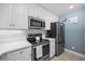 Kitchen with white cabinets, stainless steel appliances, and white subway tile at 209 North Hillside Dr. # 201, North Myrtle Beach, SC 29582
